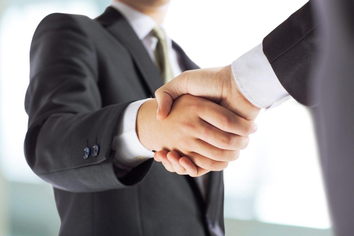 businessman shaking hands each other