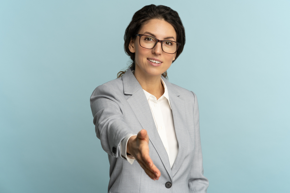 Portrait of friendly hospitable cheerful business woman